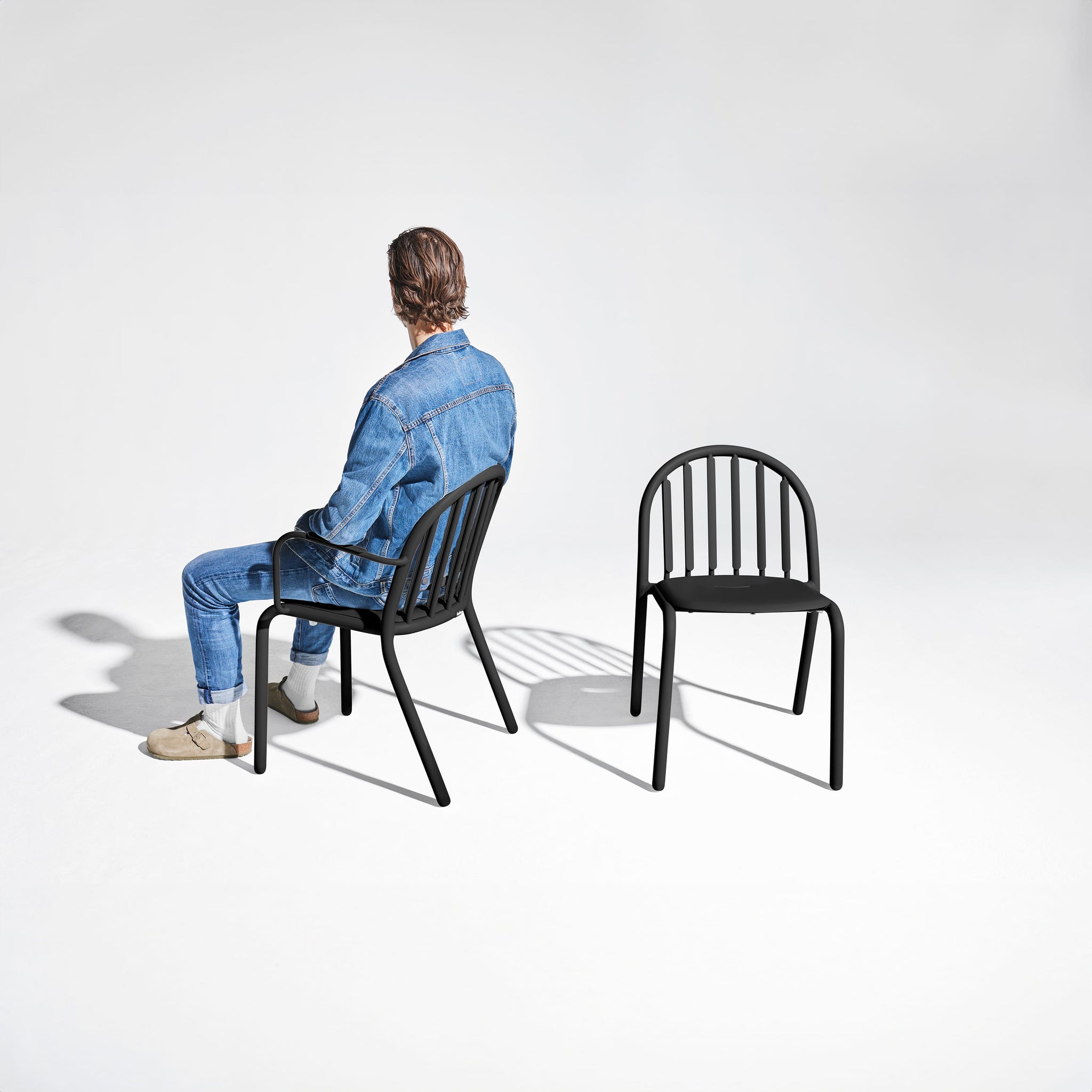 Fred’s Armchair on a sunny patio, demonstrating its UV-resistant coating for long-term durability.