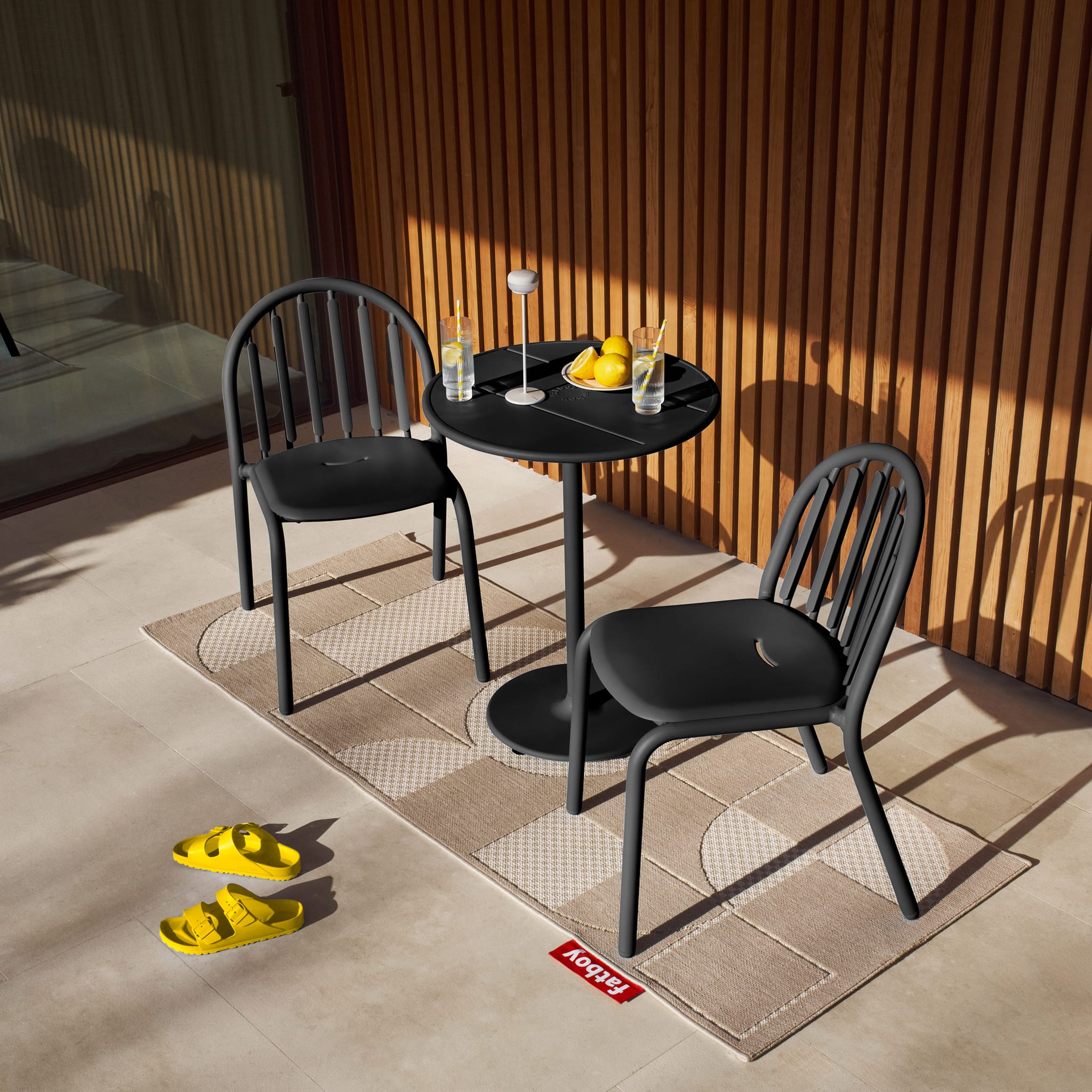 Round Fred’s Bistreau table on a rooftop terrace, combining French café charm with modern materials.