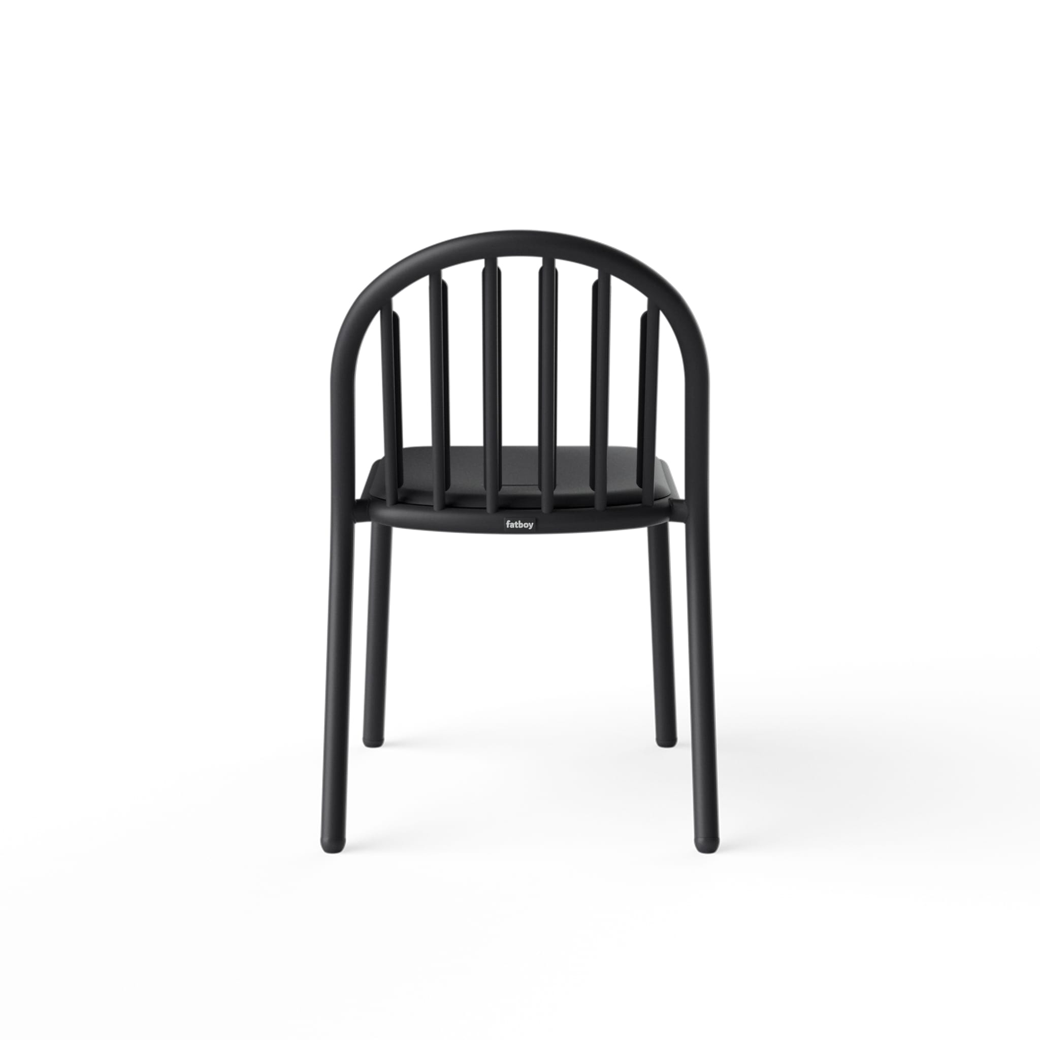 Fred’s Chair with rain droplets draining off the smile-shaped opening, highlighting its smart water-resistant design.