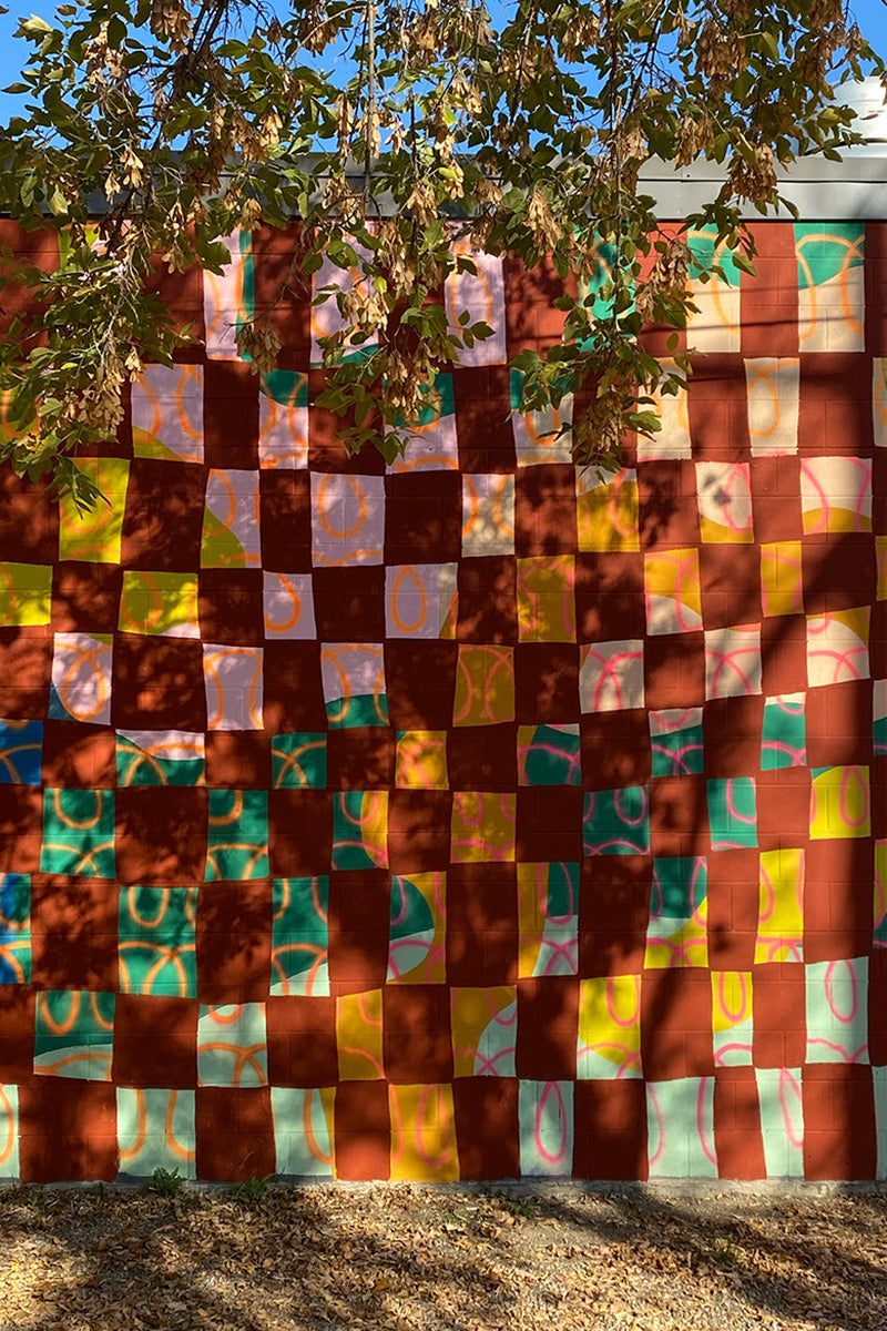 Warm toned abstract checkered outdoor mural.