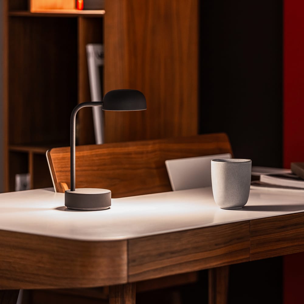 Sleek and functional, the Fokus table lamp by Kooduu offers adjustable dimming and a 40-hour battery. A modern addition to any bedside or desk.